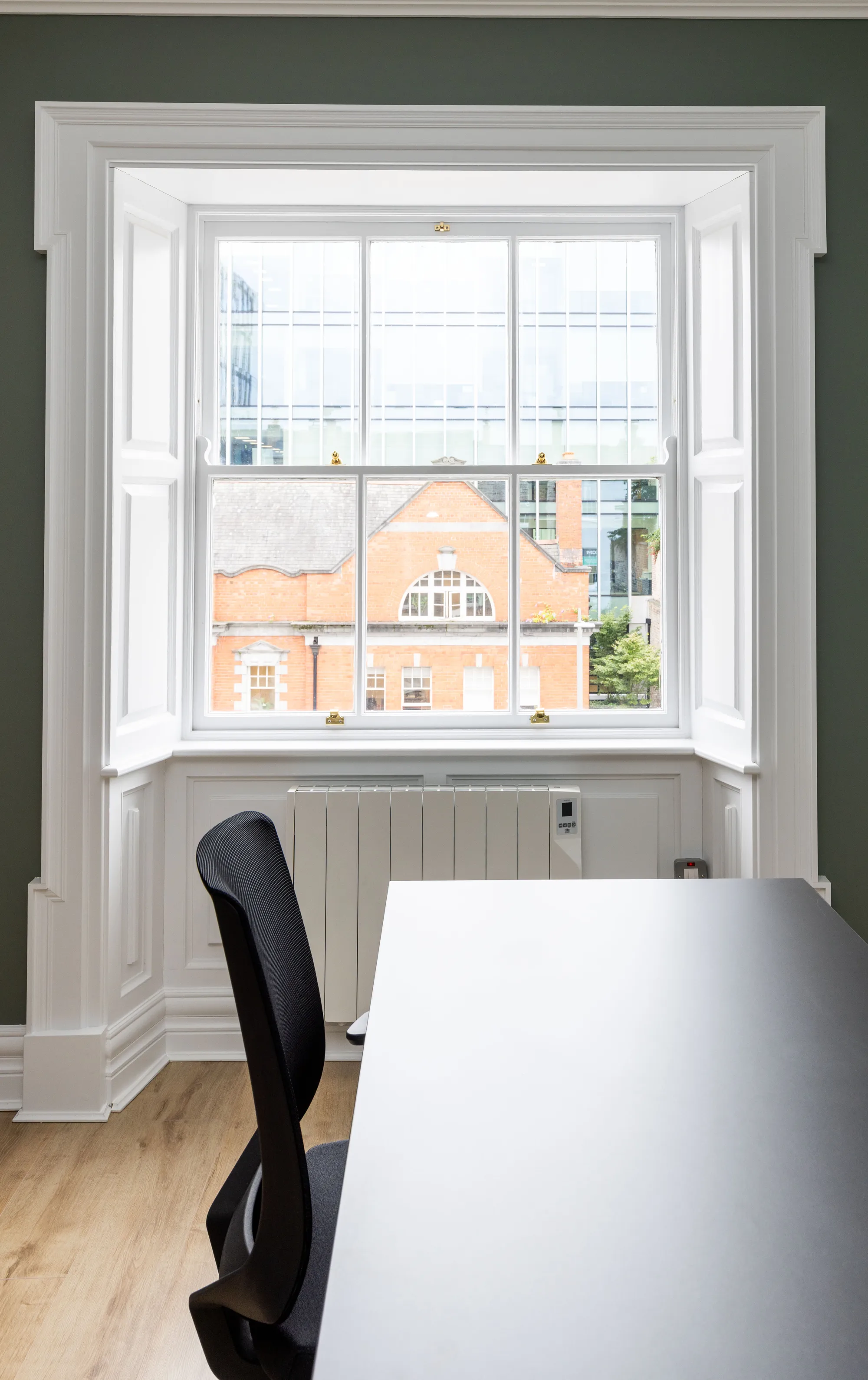 A desk at a Georgian sash window