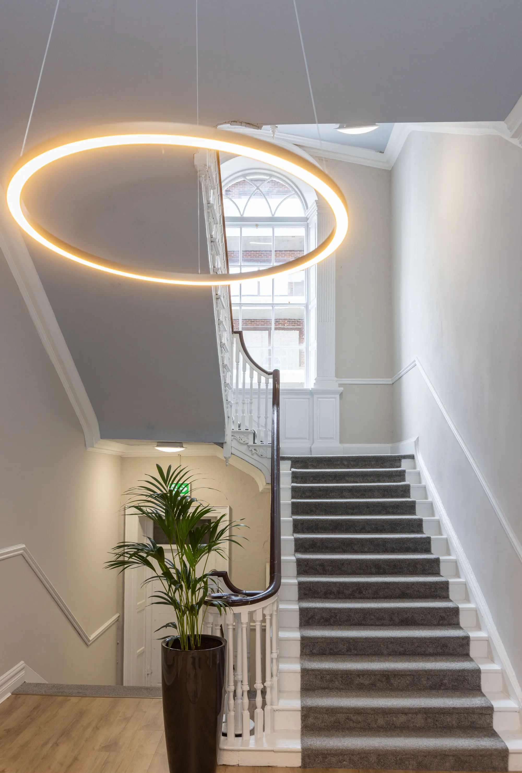 A brass ring light above the restored Georgian staircase